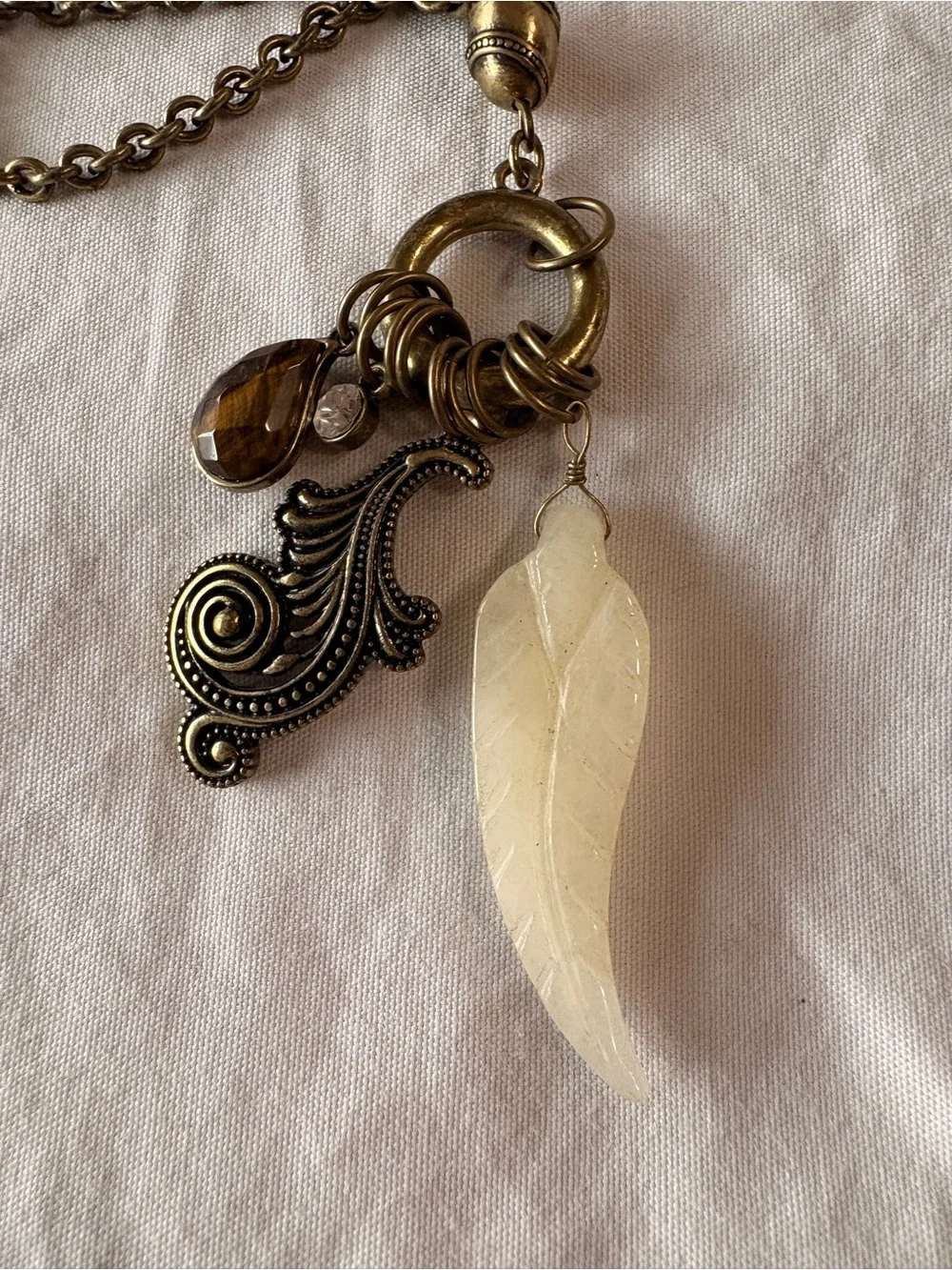 Bronze-tone Long Pendant Necklace with Cream Feather Charm